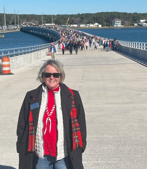 Director Amy Lock crosses bridge